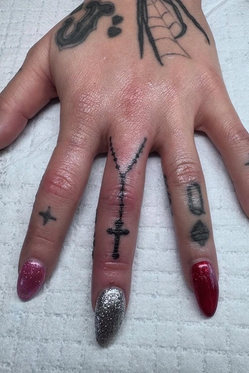 Women's Cross Finger Tattoo