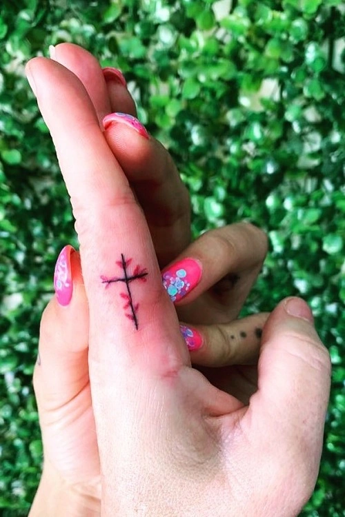 Women's Cross Finger Tattoo