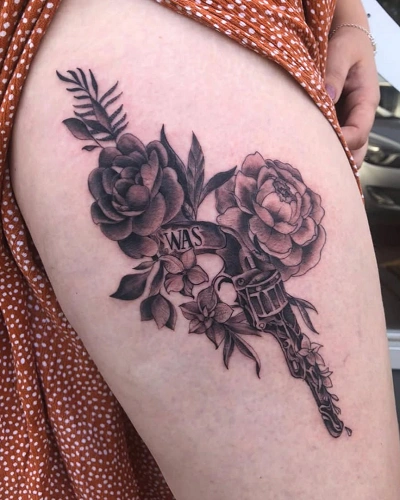 Women's Gun Tattoo on Thigh