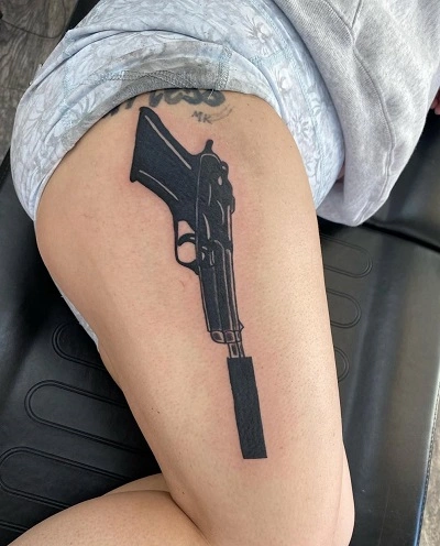 Women's Gun Tattoo on Thigh