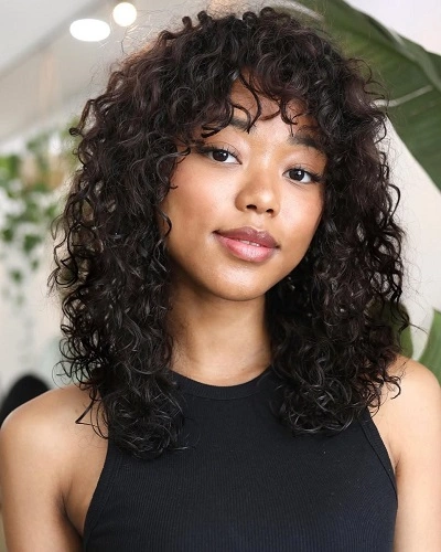 Shoulder Length Curly Cut with Bangs
