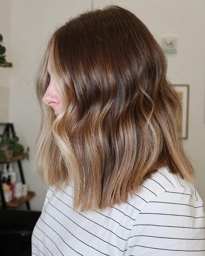 Wavy Lob with Face Framing Highlights