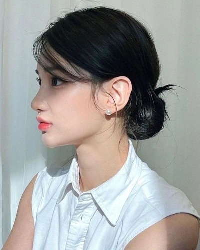 Low Bun with Loose Strands